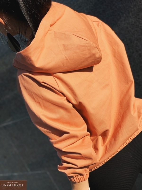 Заказать оранжевую женскую ветровку-батник с капюшоном на резинке дешево