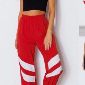 Купити червоні жіночі спортивні штани на манжеті з смужками (розмір 42-52) в Україні
