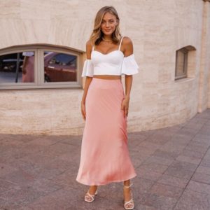 Заказать женскую (размер 40-48) розовую шёлковую юбку миди длины по скидке