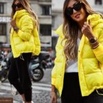 Придбати жовтого кольору глянсову куртку з капюшоном (розмір 42-52) по знижці для жінок
