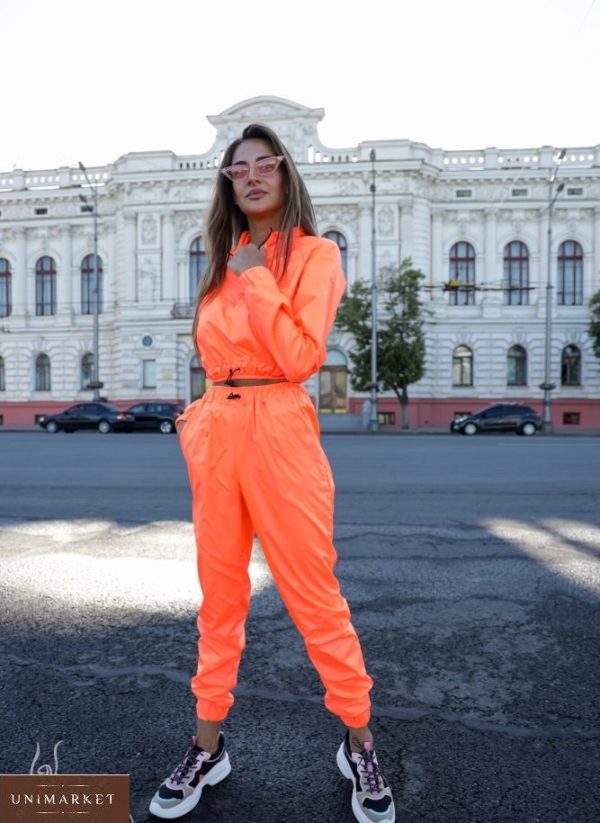 Купити вигідно жіночий неоновий спортивний костюм з укороченим худі оранжевого кольору