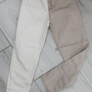 Приобрести недорого бежевые джинсы свободного кроя с белой штаниной для женщин