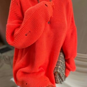 Заказать оранж, коралл женский свитер-тунику с дырками в Украине